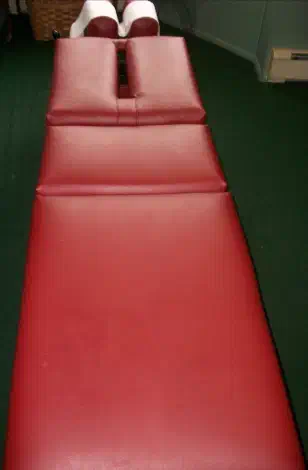 Chiropractic treatment table prepared for spinal adjustment care